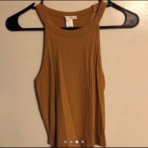 Tan cropped tank top.